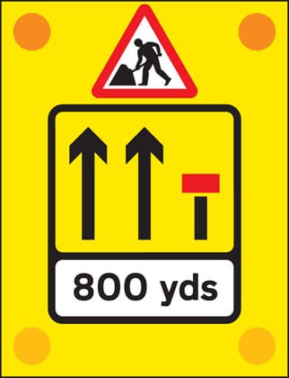 Signs used on the back of slow-moving or stationary vehicles warning of a lane closed ahead by a works vehicle. There are no cones on the road. - Image 1
